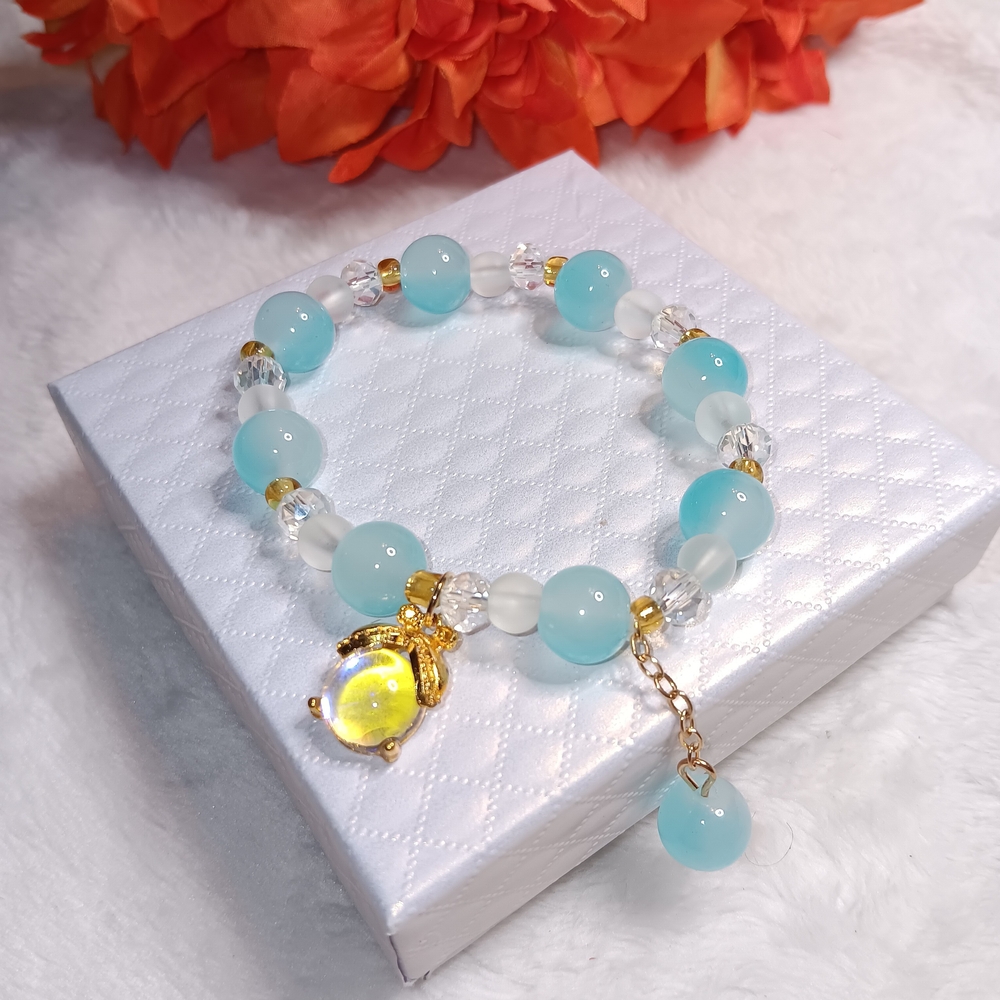 Elegant Gold and Blue Beaded Bracelet With Charm